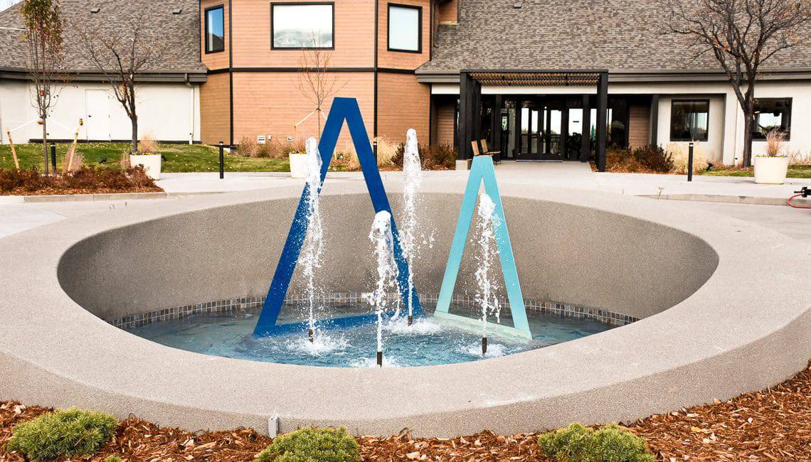 Water feature with sandscape wall basin.