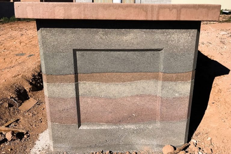 Up close rammed earth walls with five different layers and colors