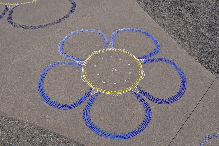 Flower design integrated into Sandscape® concrete