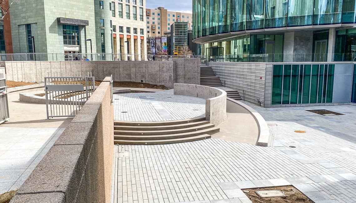 Wide view of Denver Art Museum courtyard including many decorative concrete features all completed by Colorado Hardscapes.