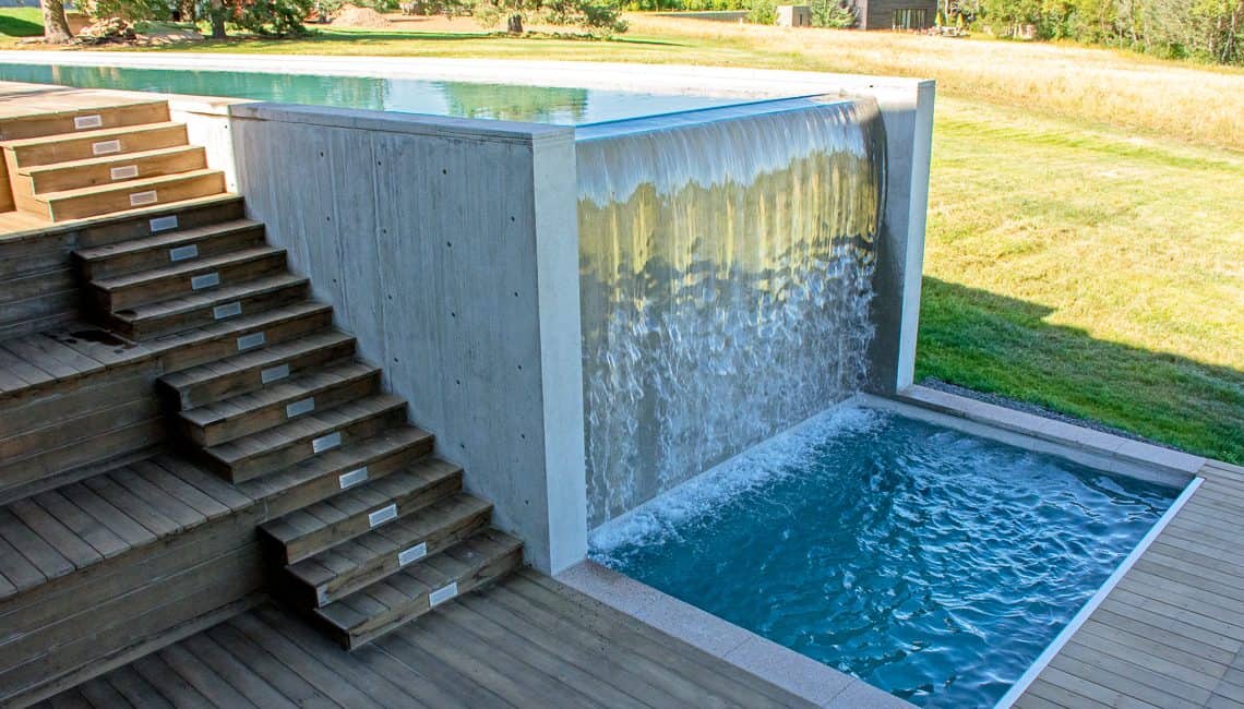 Waterfall into spa at Cherry Hills Private Residence.